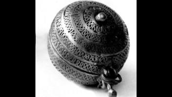 Tibetan brass rouge pot with appliqued diapered loop designs and globular form.