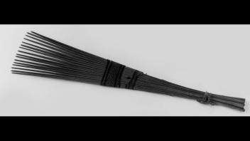 West African wooden comb with wire-work wrapping.