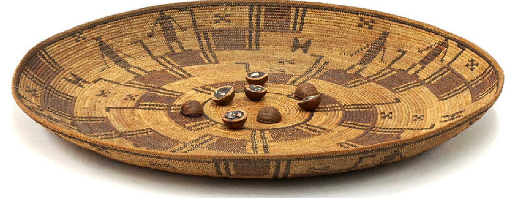 Yokuts gambling tray basket with walnut dice